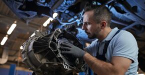 Auto Mechanic Fixing Car on Lift