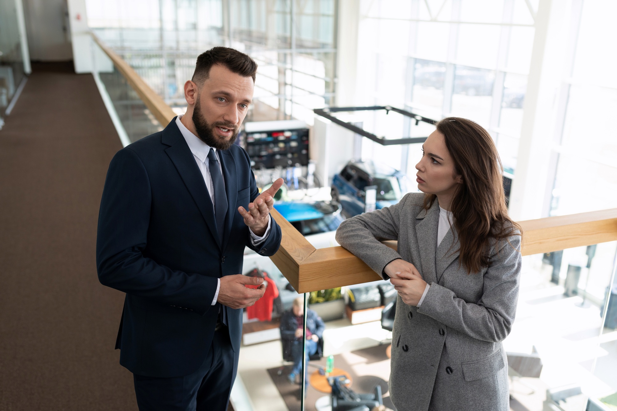 car dealership employees discuss business development strategy